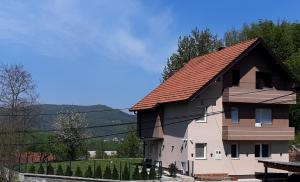 a large house with a red roof at Villa Nature Sarajevo in Sarajevo