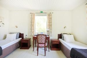 Postel nebo postele na pokoji v ubytování Hotell Björkhaga + 37 fotografií