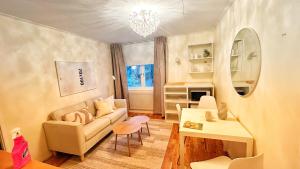 a living room with a couch and a table at Stockholm Luxury Holiday Home in Stockholm