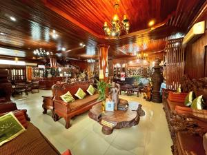 a lobby with couches and a table in a room at Shining Angkor Boutique Hotel in Siem Reap