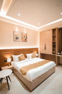 Postel nebo postele na pokoji v ubytování Hotel QUBA