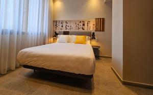 Postel nebo postele na pokoji v ubytování Cousin Room Hotel Automatizado