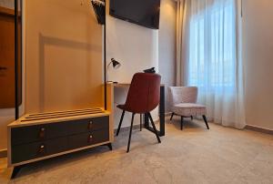 TV a/nebo společenská místnost v ubytování Cousin Room Hotel Automatizado