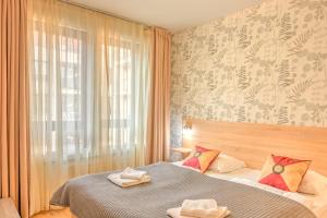 Giường trong phòng chung tại Budapest City Center Apartments +36 ảnh