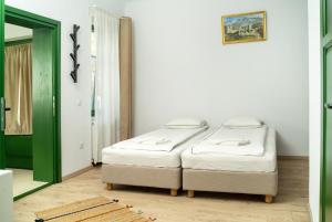 Postel nebo postele na pokoji v ubytování Casa Botár Vendégház