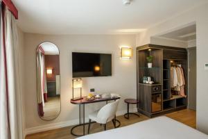 Postel nebo postele na pokoji v ubytování Hotel St Martin by OMNIA hotels