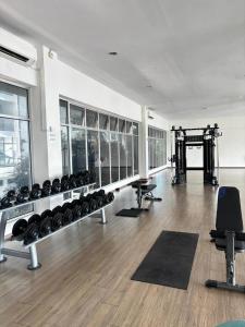 a gym with a lot of fitness equipment in a room at Sky9Haven Homestay in Ipoh
