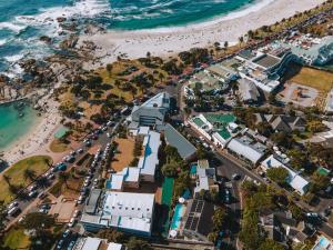 an aerial view of a beach and the ocean at Camps Bay Village - Beach Studios in Cape Town +43 photos