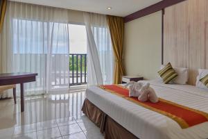 Postel nebo postele na pokoji v ubytování Bellevue Ocean Patong + 37 fotografií