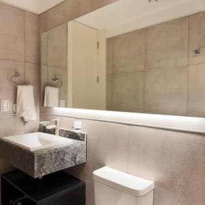 a bathroom with a sink and a mirror at Rossi Tiny in Villa Mercedes