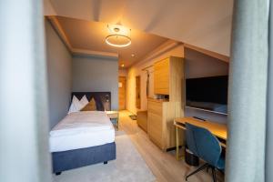 Postel nebo postele na pokoji v ubytování Hotel Zum Mohren