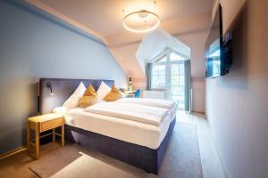 Postel nebo postele na pokoji v ubytování Hotel Zum Mohren