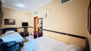 Postel nebo postele na pokoji v ubytování Dancenter San Marino Hotel