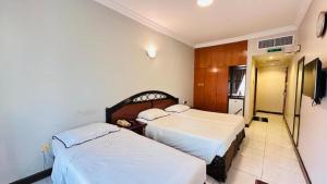 Postel nebo postele na pokoji v ubytování Dancenter San Marino Hotel