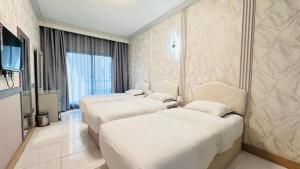Postel nebo postele na pokoji v ubytování Dancenter San Marino Hotel