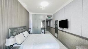 TV a/nebo společenská místnost v ubytování Dancenter San Marino Hotel