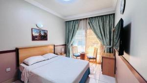 Postel nebo postele na pokoji v ubytování Dancenter San Marino Hotel