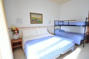 Postel nebo postele na pokoji v ubytování Hotel Man