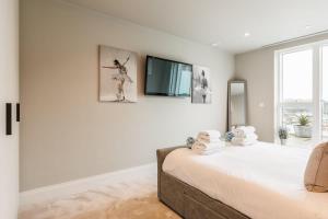 Ένα ή περισσότερα κρεβάτια σε δωμάτιο στο Harbours Edge - Front-Line Harbour Views