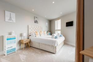 Ένα ή περισσότερα κρεβάτια σε δωμάτιο στο Harbours Edge - Front-Line Harbour Views