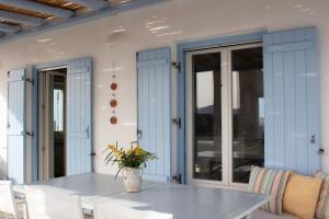 a dining room with a table and chairs at Sunny House in Pounda