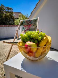 a bowl of fruit sitting on top of a table at Villa Terraca in Mandre
