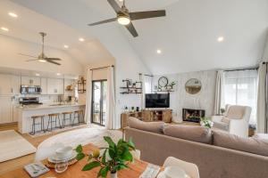 a living room with a couch and a fireplace at 1 Mi to Coast Family-Friendly Gem in Solana Beach in Solana Beach