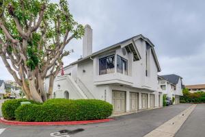 a white house with a tree on a street at 1 Mi to Coast Family-Friendly Gem in Solana Beach in Solana Beach