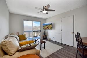 a living room with a couch and a ceiling fan at Ski Resort Backyard Walk to Lifts Brewery Coffee in Beech Mountain