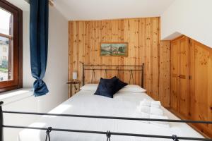 Postel nebo postele na pokoji v ubytování Residence Madamin