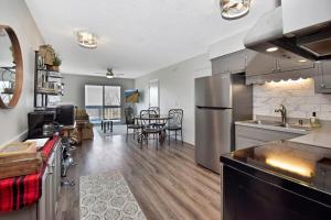 a kitchen and dining room with a table in it at Ski Resort Backyard Walk to Lifts Brewery Coffee in Beech Mountain