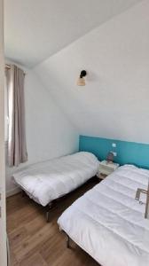 Postel nebo postele na pokoji v ubytování La Cormorane