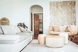 a living room with a white couch and a table at Beachfront 2BR Villa w Private Pool in Koh Phangan +19 photos