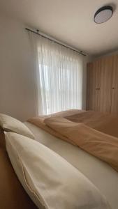 Postel nebo postele na pokoji v ubytování Apartments Wally