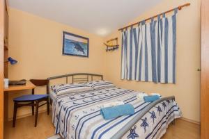 Postel nebo postele na pokoji v ubytování Apartman Lucija