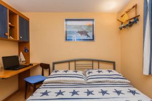 Postel nebo postele na pokoji v ubytování Apartman Lucija