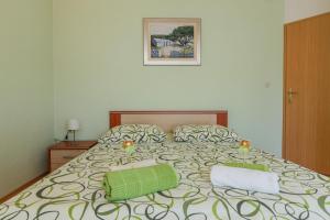 Postel nebo postele na pokoji v ubytování Apartman Lucija