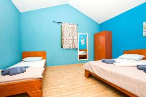 Posteľ alebo postele v izbe v ubytovaní Apartment Porat