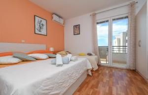 Postel nebo postele na pokoji v ubytování Apartments JoviZe