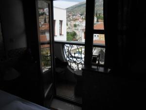 a view out of a window of a balcony at Villa Anri in Mostar +44 photos