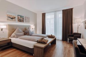 Postel nebo postele na pokoji v ubytování Hotel Inselhof Borkum