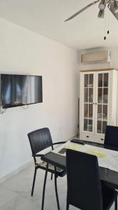 a dining room with a table and chairs at Seaside Holiday Home Ema in Vela Luka