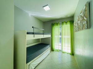 En eller flere senge i et værelse på Brisa do mar Riviera de São Lourenço + 30 billeder