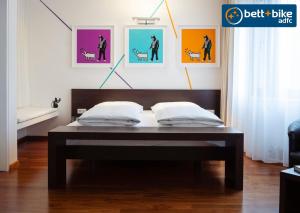 A bed or beds in a room at arte Hotel Linz