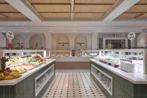 a buffet line with fruits and vegetables on display at Atlantica Aeneas Resort in Ayia Napa