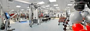 a gym with lots of equipment in a room at City Premiere Hotel Apartments - Dubai in Dubai