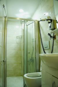 a bathroom with a shower and a toilet and a sink at Family Hotel Taksim in Istanbul +20 photos