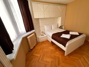 Una cama o camas en una habitación de Urban Nest Sarajevo