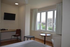 TV a/nebo společenská místnost v ubytování Hotel Balaguer