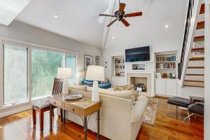 a living room with a couch and a ceiling fan at Spinnaker 780 in Seabrook Island